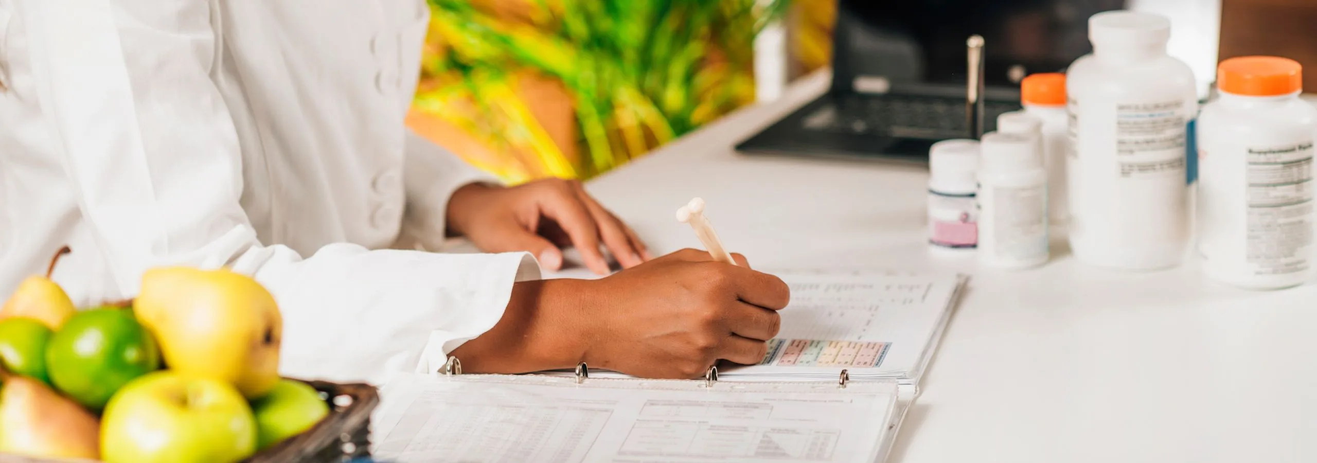 Woman writing about functional medicine and mental health care.