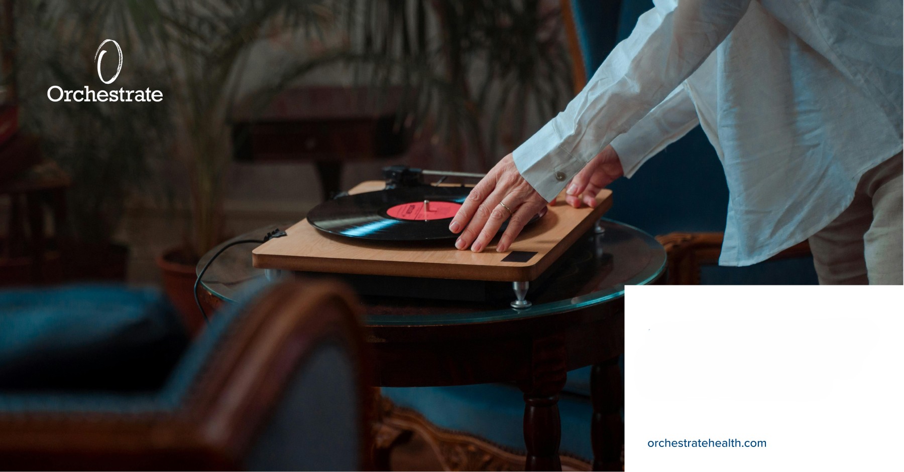 person playing a record on a record player