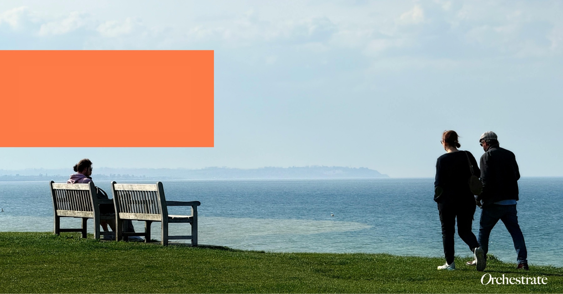 2 people walking along a cliff edge